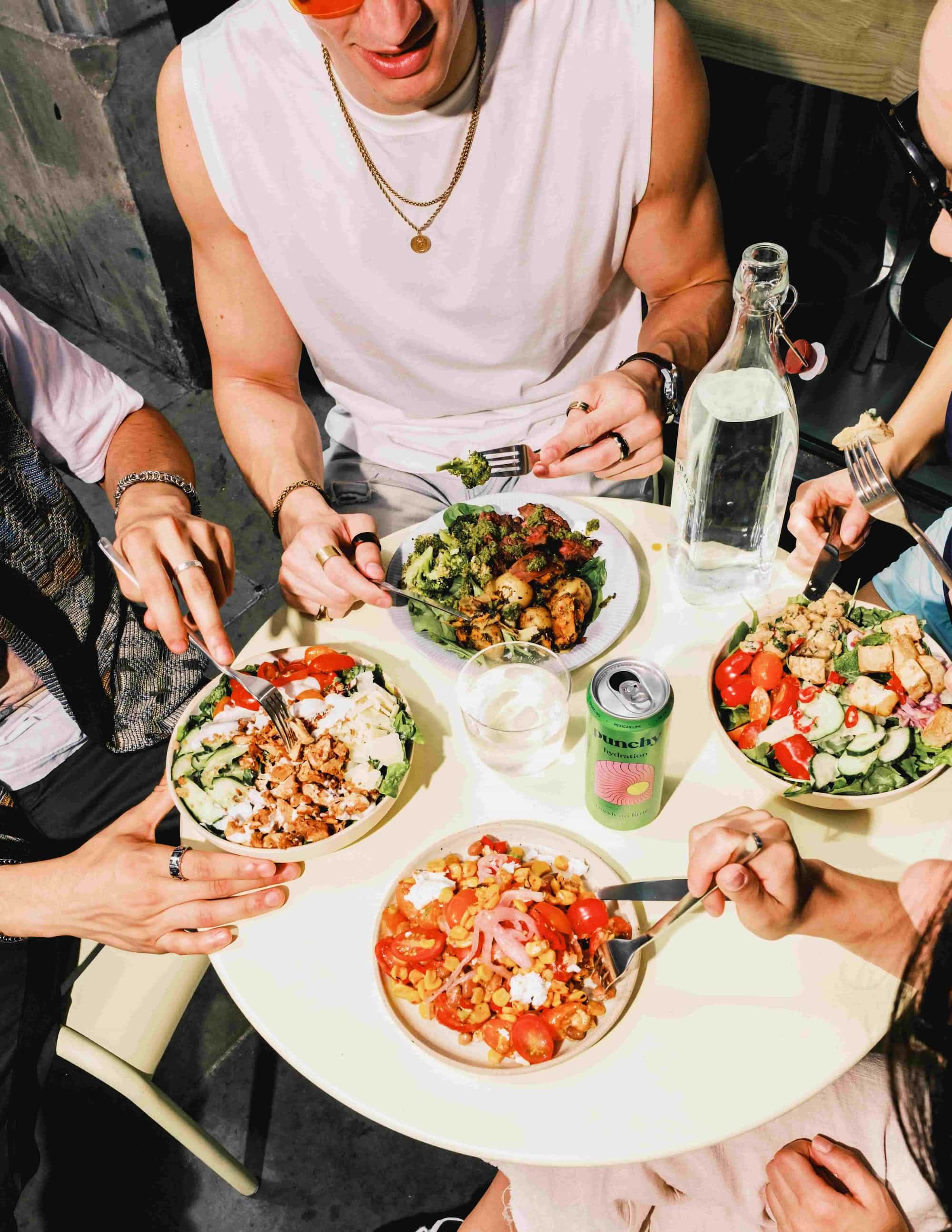 Friends sharing Prepd bowls together at lunch