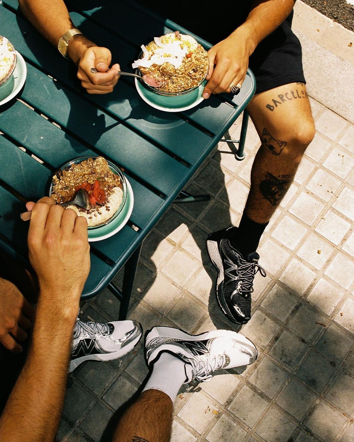 Friends digging into breakfast bowls after a run